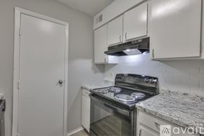 Nashville apartment for rent - A kitchen with a stove top oven and a dishwasher.