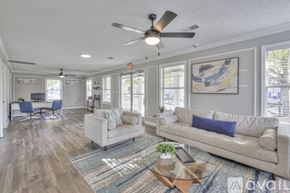 Nashville apartment for rent - A living room with a couch, chairs, and a rug.