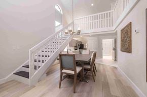 Kissimmee apartment for rent - A dining room with a wooden table and chairs.