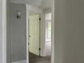 Akron house for rent - A white door is open to a hallway.