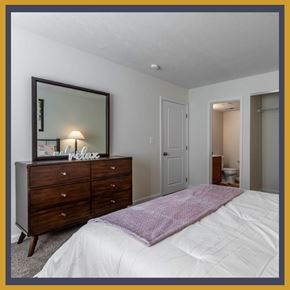 Dayton apartment for rent - A bedroom with a bed, dresser, and mirror.