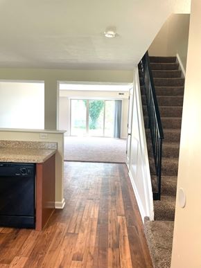 Dayton apartment for rent - A kitchen with a dishwasher and a staircase.