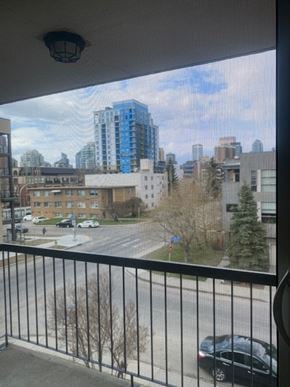Calgary apartment for rent - A black car is parked on the street below.