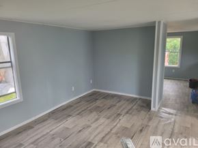 Dublin apartment for rent - A room with light grey walls and wooden flooring is available for rent.
