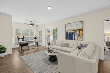 Atlanta apartment for rent - A living room with a white couch and a painting on the wall.