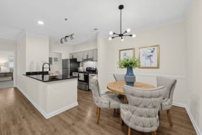 Atlanta apartment for rent - A modern kitchen with a dining table and chairs.