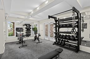 Atlanta apartment for rent - A spacious home gym with a variety of exercise equipment.