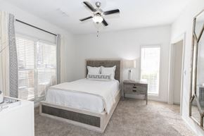 Atlanta apartment for rent - a bedroom with a bed and a ceiling fan