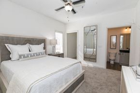 Atlanta apartment for rent - a bedroom with a bed and a ceiling fan