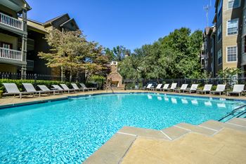 Sparkling swimming pool and poolside cabana with television