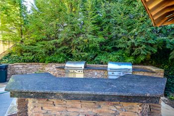 Built-in poolside gas grill with luxury outdoor kitchen