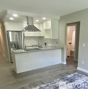 Shakopee apartment for rent - A modern kitchen with a large island and stainless steel appliances.