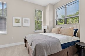 Atlanta apartment for rent - A bedroom with a large bed and two pictures on the wall.