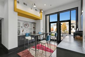Atlanta apartment for rent - a dining area with a table and chairs and a kitchen with glass doors