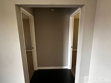 Wheaton apartment for rent - A kitchen with black cabinets and a tiled floor.