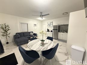 Little Torch Key apartment for rent - A modern dining room with a round table and chairs.