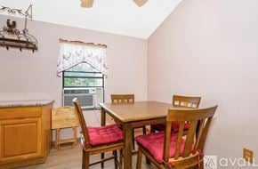 Palm Bay house for rent - A dining room with a table and chairs.