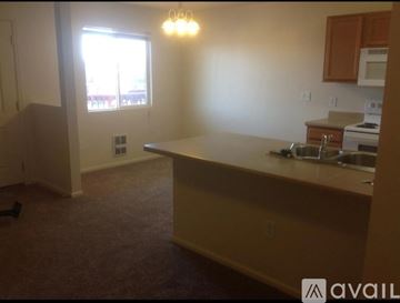 Laramie apartment for rent - A kitchen area with a sink and a window.