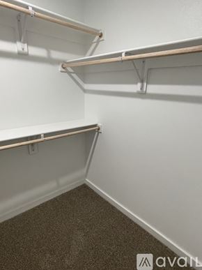 Lubbock house for rent - Empty shelves in a room with carpeted floor.