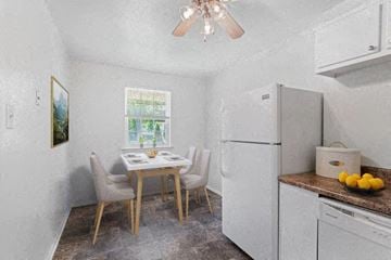 Voorhees apartment for rent - a kitchen with a table and chairs and a refrigerator