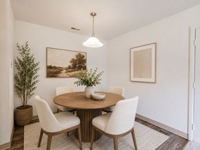 East Brunswick apartment for rent - A dining room with a round table and chairs.