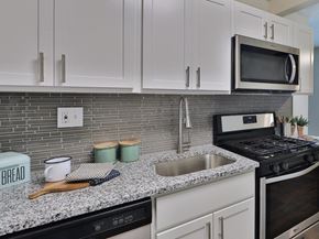 East Brunswick apartment for rent - a kitchen with white cabinets and a sink