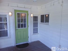 Sarasota house for rent - A room with a ceiling fan and wooden flooring.