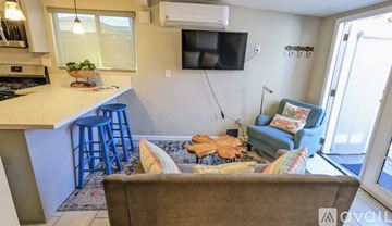 San Diego apartment for rent - A living room with a couch and a television.