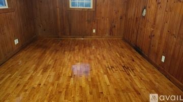 Ronda house for rent - A kitchen with a white stove and wooden cabinets.