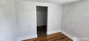 Kalamazoo house for rent - A room with a doorway leading to another room.