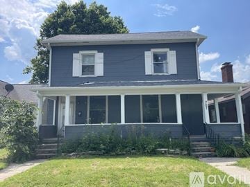 Terre Haute apartment for rent - A two-story house with a front porch and a white door.