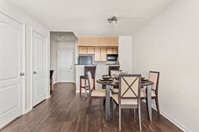 Creve Coeur apartment for rent - Open dining area with hardwood flooring and overhead lighting next to kitchen