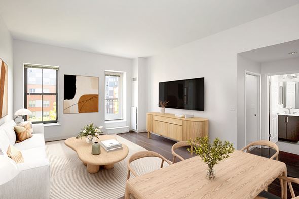 Boston apartment for rent - a living room with a couch and a table and a tv