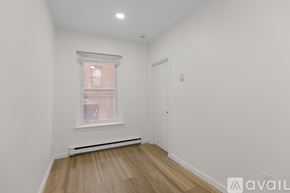 Boston apartment for rent - A room with a window and a door.