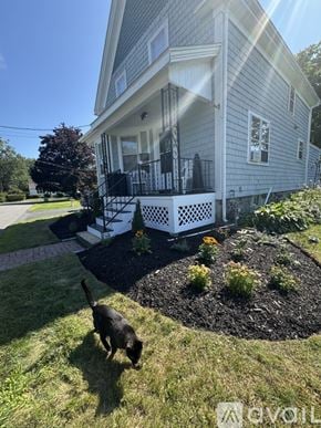Danvers house for rent - A blue house with a white trim and a large front porch.