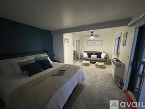 Stateline condo for rent - A bedroom with two beds and a couch in the corner.