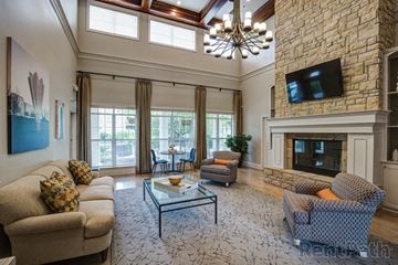 Overland Park apartment for rent - a living room with couches and a fireplace and a tv