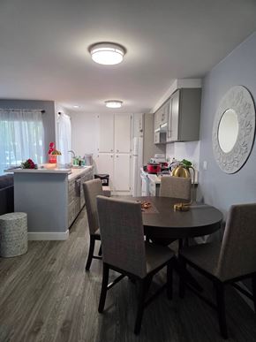 Inglewood house for rent - A kitchen with a table and chairs in the foreground.