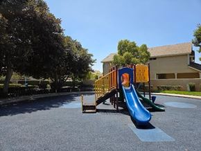 Inglewood house for rent - A playground with a blue slide and a yellow structure.