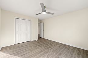 Lithonia house for rent - A room with a ceiling fan and two doors.