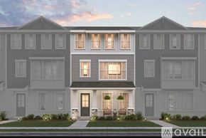 Orlando townhouse for rent - A row of modern townhouses with front yards and landscaping.