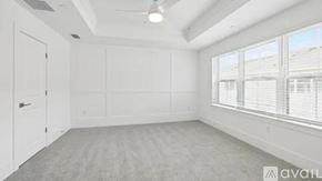 Orlando townhouse for rent - A spacious room with a large window and a door.