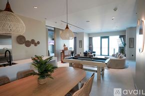 Las Vegas apartment for rent - A modern dining room with a wooden table and chairs.
