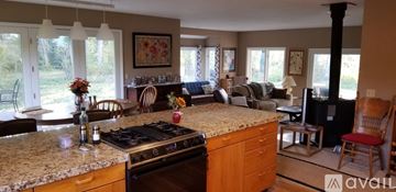 Hailey house for rent - A kitchen with a stove top oven and a counter top.