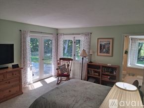 Hailey house for rent - A bedroom with a bed, dresser, chair, and window.