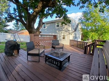 Waynesboro house for rent - A kitchen with white cabinets and black appliances.