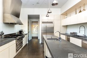 Las Vegas apartment for rent - A modern kitchen with a large island and stainless steel appliances.