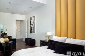 Las Vegas apartment for rent - A bedroom with a large bed and a painting on the wall.