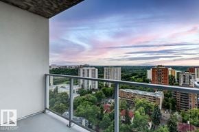Edmonton townhouse for rent - A modern kitchen with a large island and stainless steel appliances.