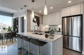 Edmonton townhouse for rent - A large, empty room with a view of the outdoors through large windows.